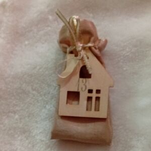 Charming Wooden House Ornament with Gold Accents